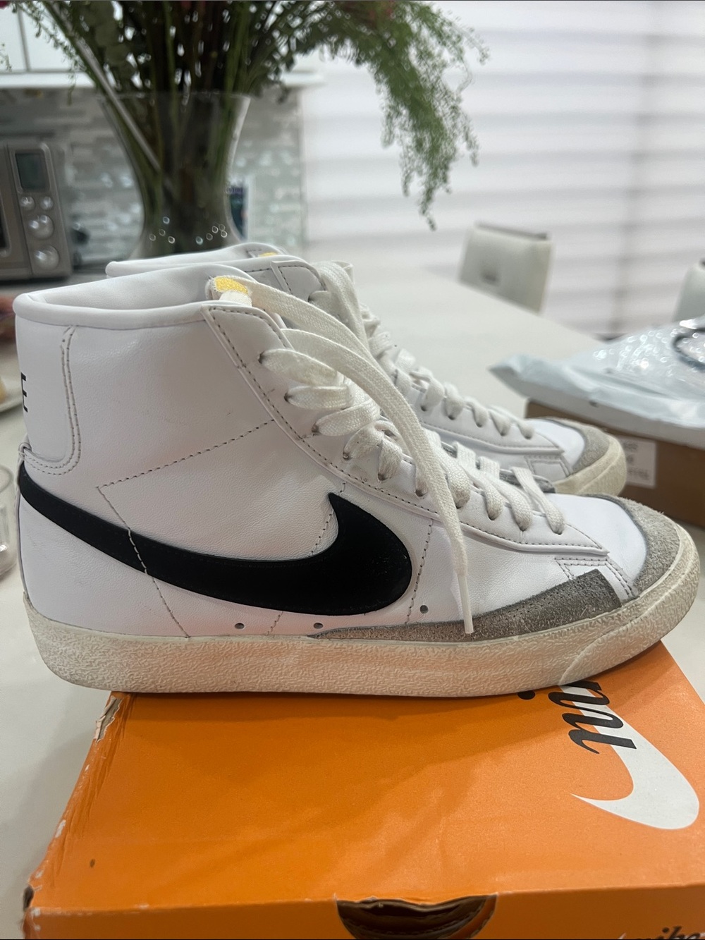 Nike White High-Top Sneakers with Black Swoosh